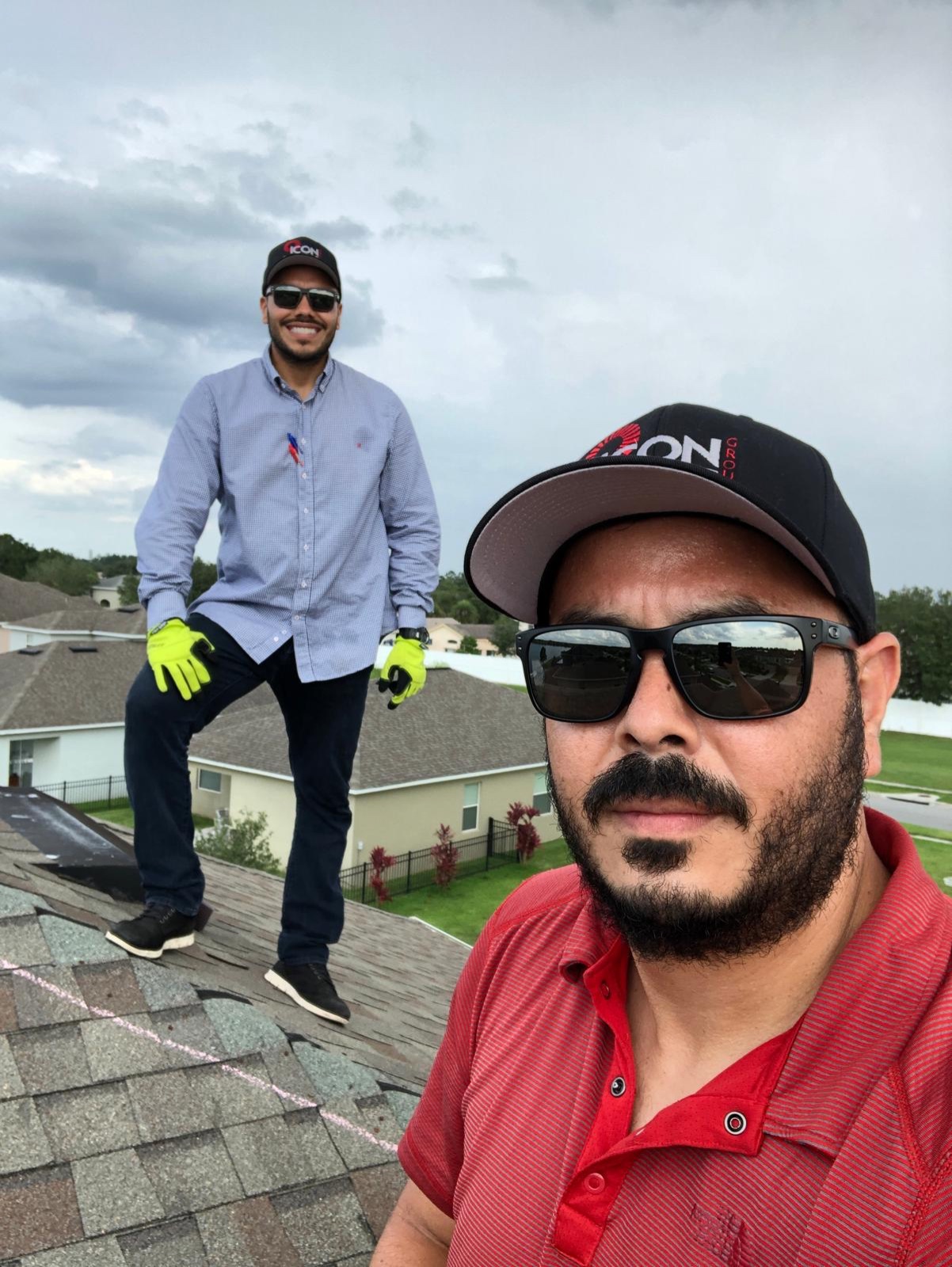 Icon Roofing Group team on a completed roof
