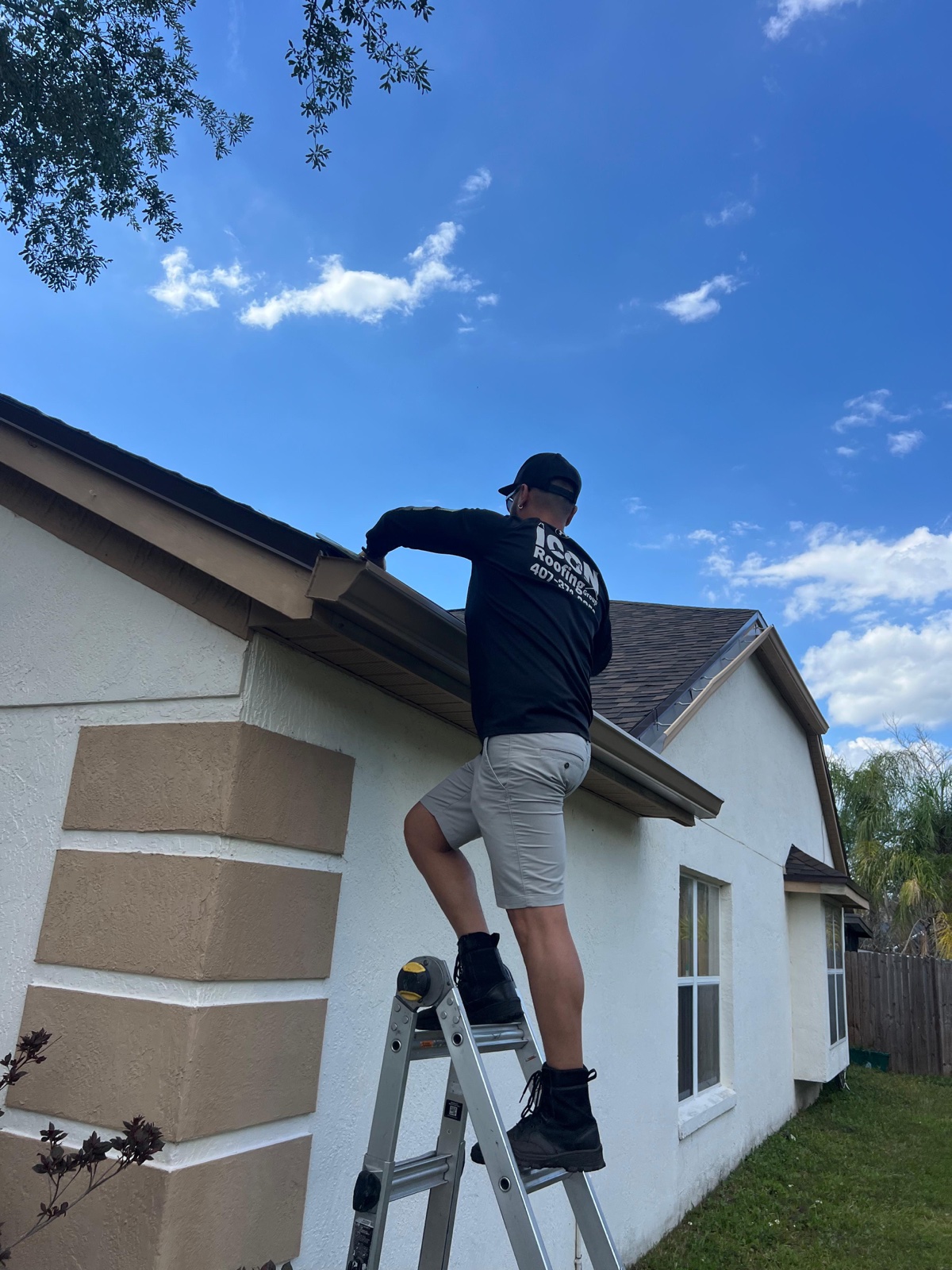 Icon Roofing Group crew member working on a roof